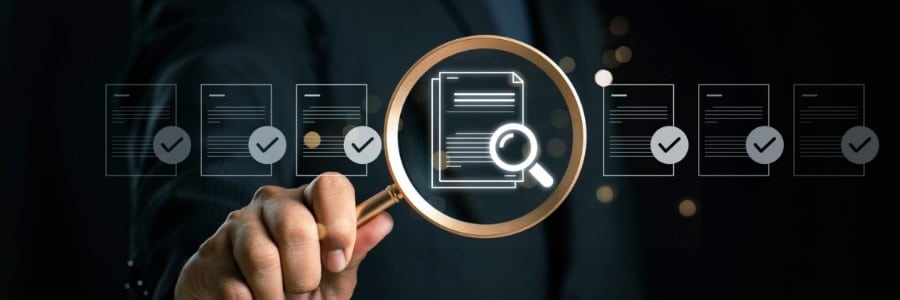 Business analyst analyzing spreadsheet data on computer screen